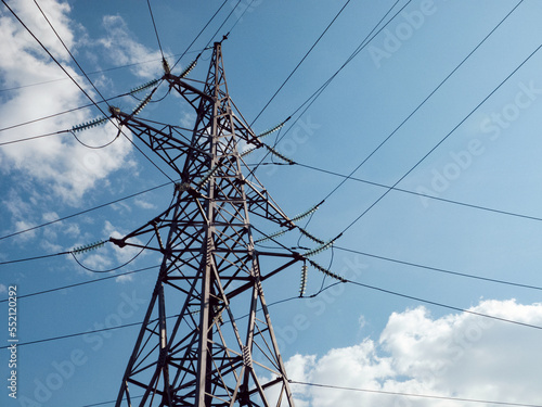 High-voltage power transmission tower connecting multiple lines.