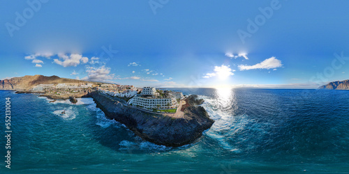 360 degrees aerial view of a coastal town - Puerto de Santiago with the Charco del Tancon - natural basin in Los Gigantes,Tenerife Island, Canary. 