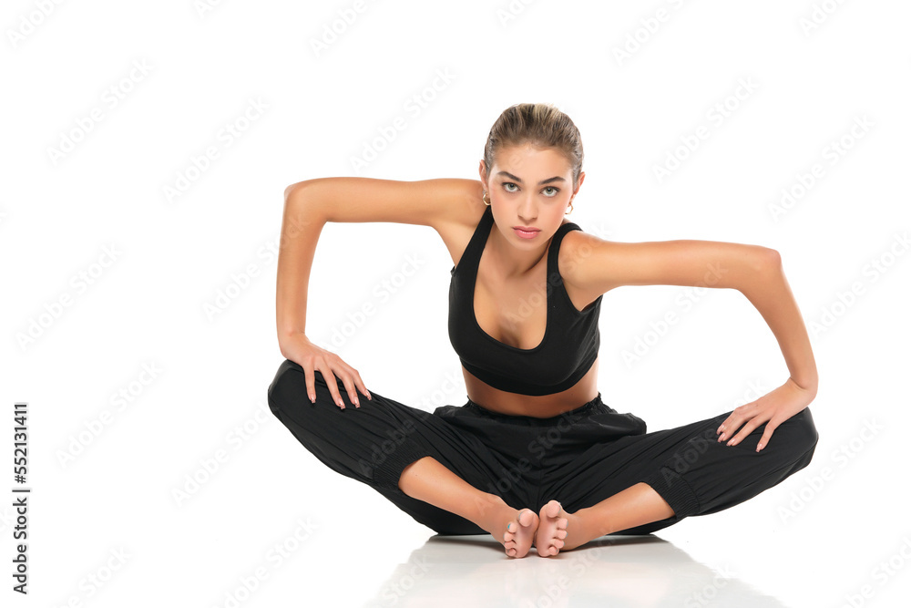 young sitting woman in sport clothes on white background young sitting woman in sport clothes on white background