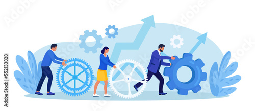Business organization. Teamwork. People working together to help success mission. Businessmen are engaged in business promotion. Cooperation or community concept. Employees create mechanism with cogs photo