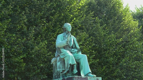 Statue of Hans Christian Andersen, danish fairy tales writer in a park in Copenhagen, Denmark photo