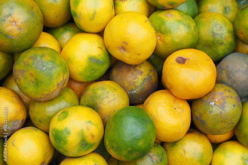 Ripe oranges as background, Sweet ripe oranges are sold in traditional markets