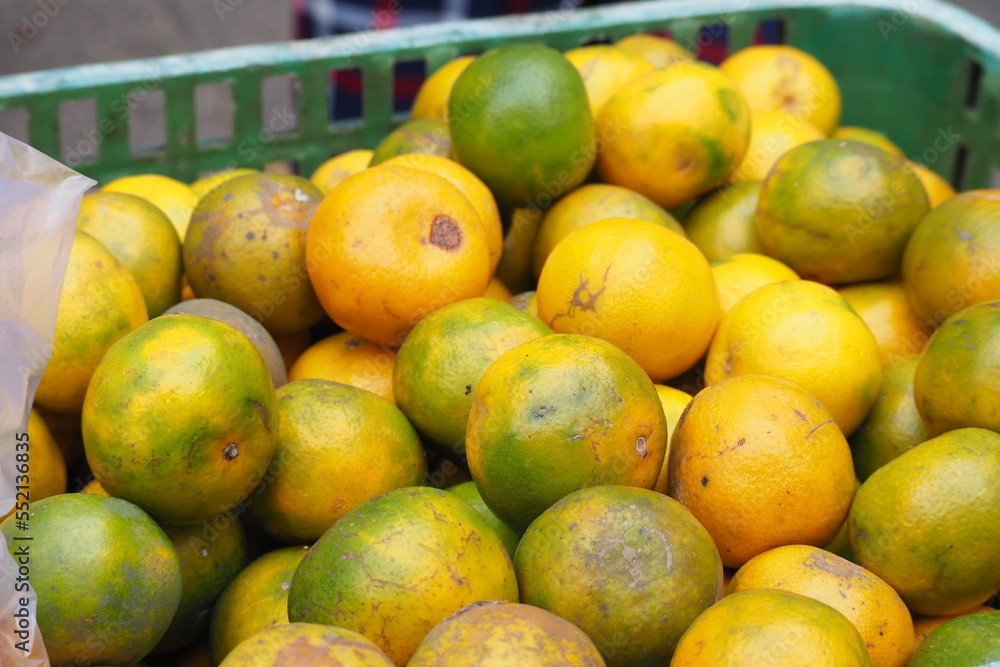 Ripe oranges as background, Sweet ripe oranges are sold in traditional markets Ripe oranges as background, Sweet ripe oranges are sold in traditional markets