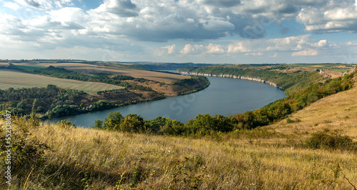 Scenic panorama view of Dnister River in Ukraine. Incredible nature landscape. Amazing autumn scenery. Majestic calm river and perfect sky over Dnister canyon of Ukraine. Popular touristic landsmarks