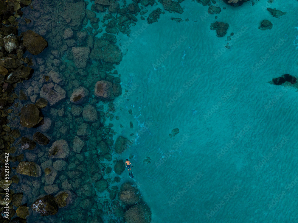 Aerial views with person snorkeling off the coast of Europe Aerial views with person snorkeling off the coast of Europe