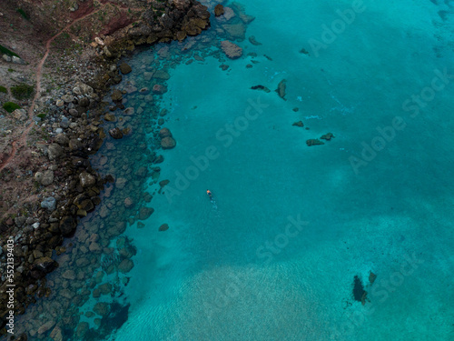 Aerial views with person snorkeling off the coast of Europe