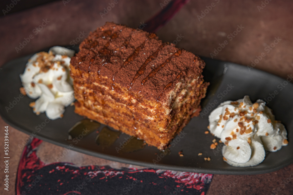 Piece of honey cake with cream Piece of honey cake with cream