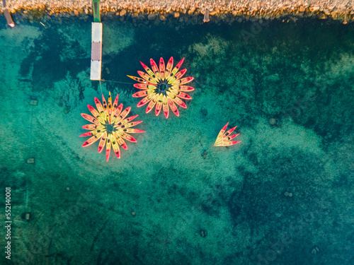Aerial views with drone filming people kayaking off the coast of Europe.