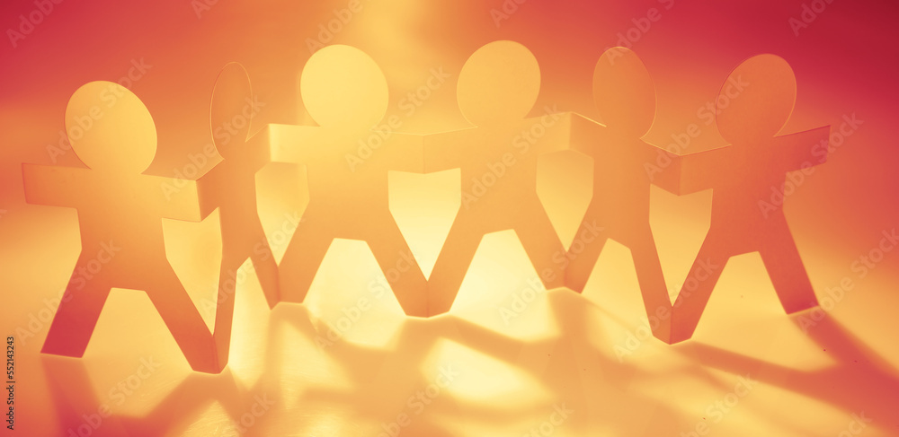 Paper chain team holding hands. Teamwork. Partnership Paper chain team holding hands. Teamwork. Partnership