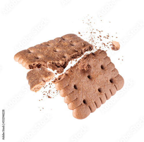 Obraz na plátně Delicious biscuit crushed into two halves in the air close-up on a white backgro