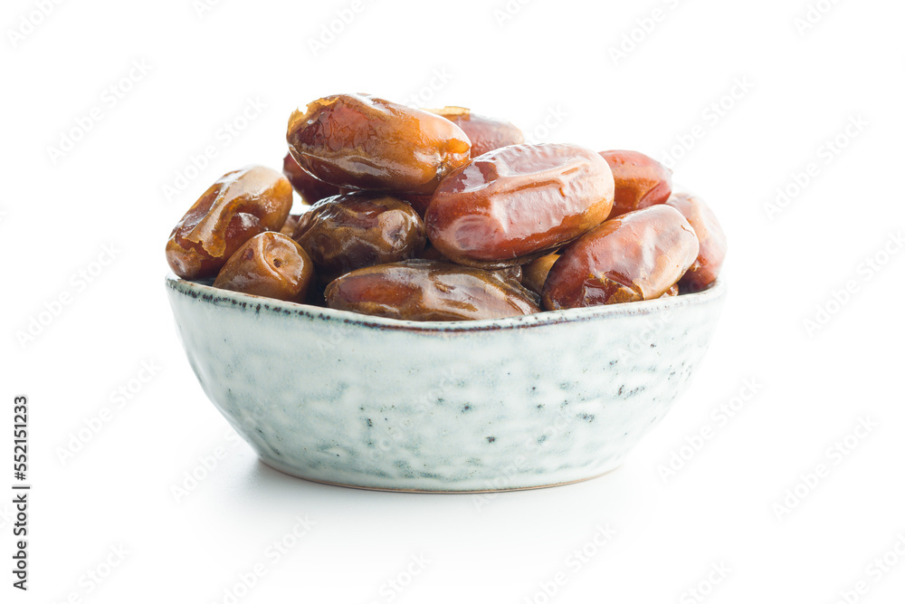Dried dates fruit in bowl. isolated on white background. Dried dates fruit in bowl. isolated on white background.
