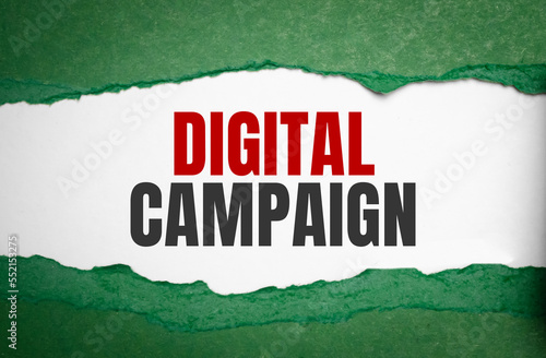 digital campaign words on green torn paper. Business concept