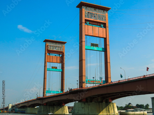 The famous Ampera bridge in Palembang, South Sumatera, Indonesia. This bridge cross over Musi River, the second longest river in Sumatra Island. photo