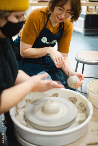 Class on modeling of clay on a potter's wheel In a ceramic workshop