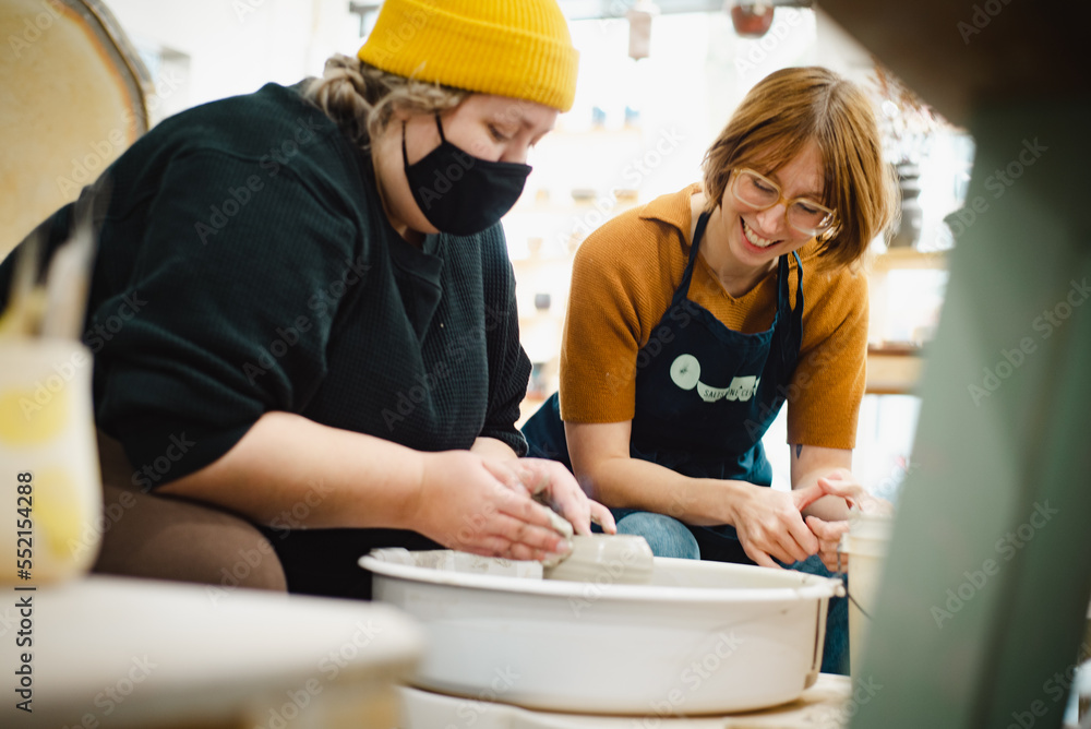 Class on modeling of clay on a potter's wheel In a ceramic workshop Class on modeling of clay on a potter's wheel In a ceramic workshop