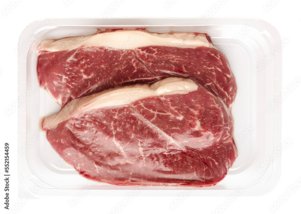 Fresh raw beef steaks in vacuum packaging on a transparent background. isolated object. top view