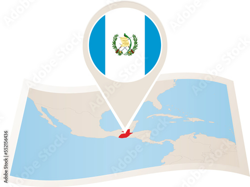 Folded paper map of Guatemala with flag pin of Guatemala. 
