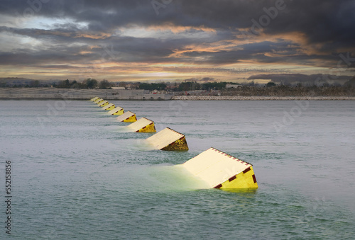 MOSE System in Venice, Italy at the sunset for defense against high waters. Barrier against the high water in the defense of Venice Lagoon. New generation of industrial flood prevention system.