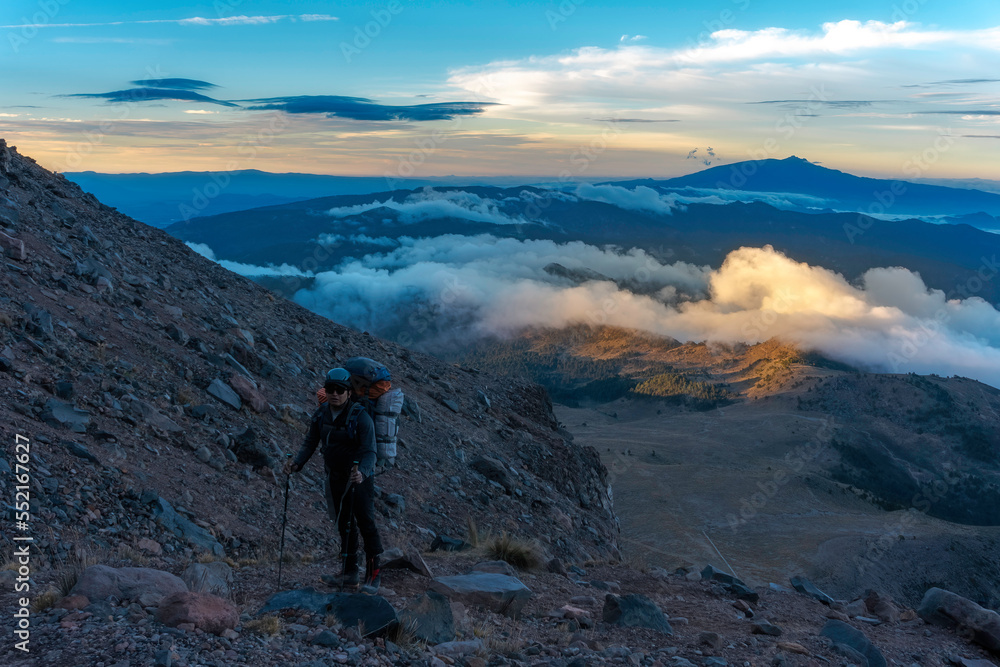 Fototapeta premium a man ascending the pico de orizaba volcano
