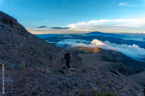 man ascending the pico de orizaba volcano