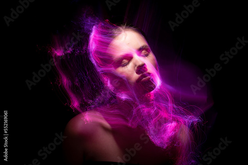 Abstract photography in the style of light painting. girl on a black background
