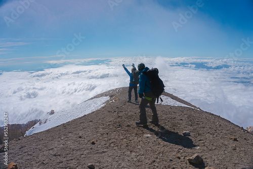 mountaineers on the summit of the pico de orizaba volcano photo