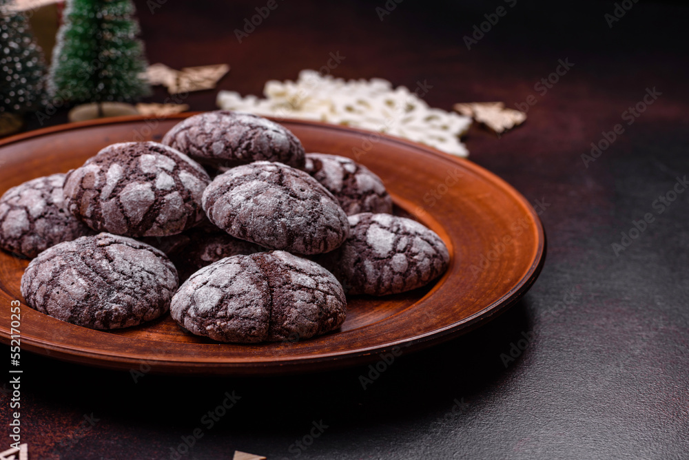 Delicious fresh brownies with Christmas decorations on a dark concrete background Delicious fresh brownies with Christmas decorations on a dark concrete background