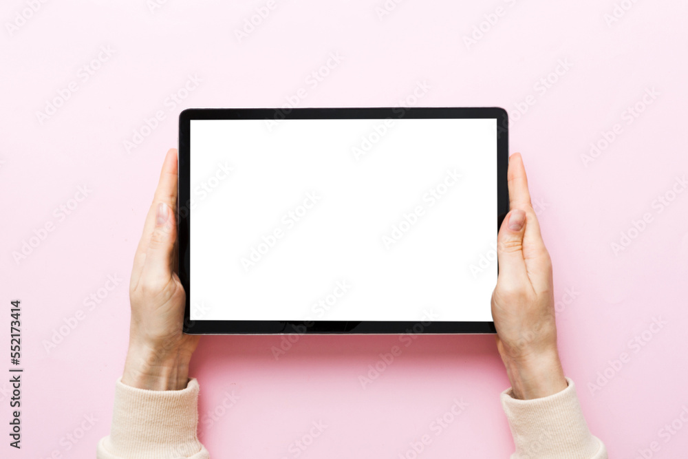 female teen hands using tablet pc with white screen, Mockup image of woman hand holding white tablet pc with blank white screen at home female teen hands using tablet pc with white screen, Mockup image of woman hand holding white tablet pc with blank white screen at home