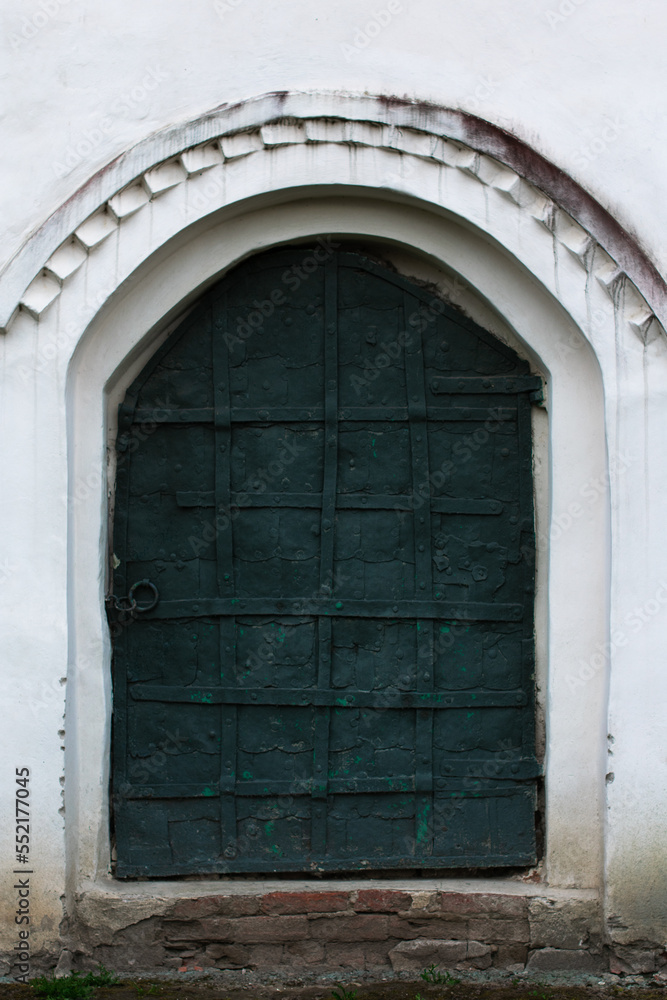 Fototapeta premium old vintage door on white house