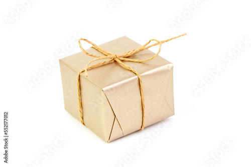 Gift box with bow isolated on white. Wrapped Christmas or birthday golden color gift box. Single present