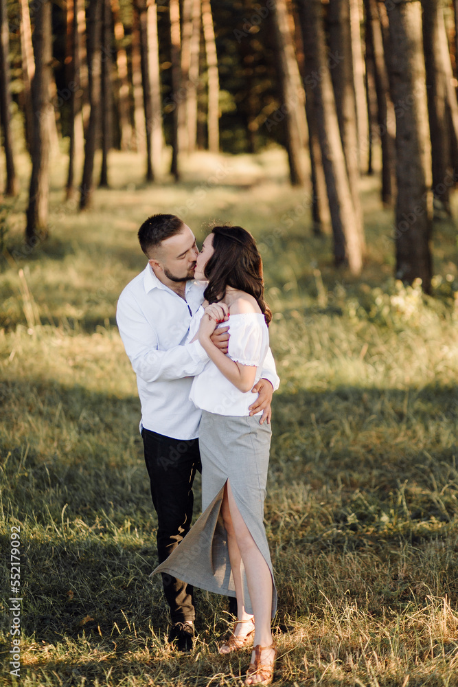 Fototapeta premium Young couple in love walking in the park