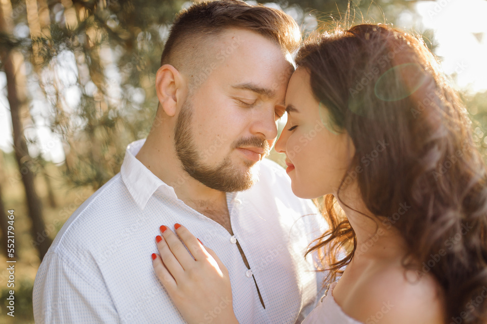 Fototapeta premium Young couple in love walking in the park