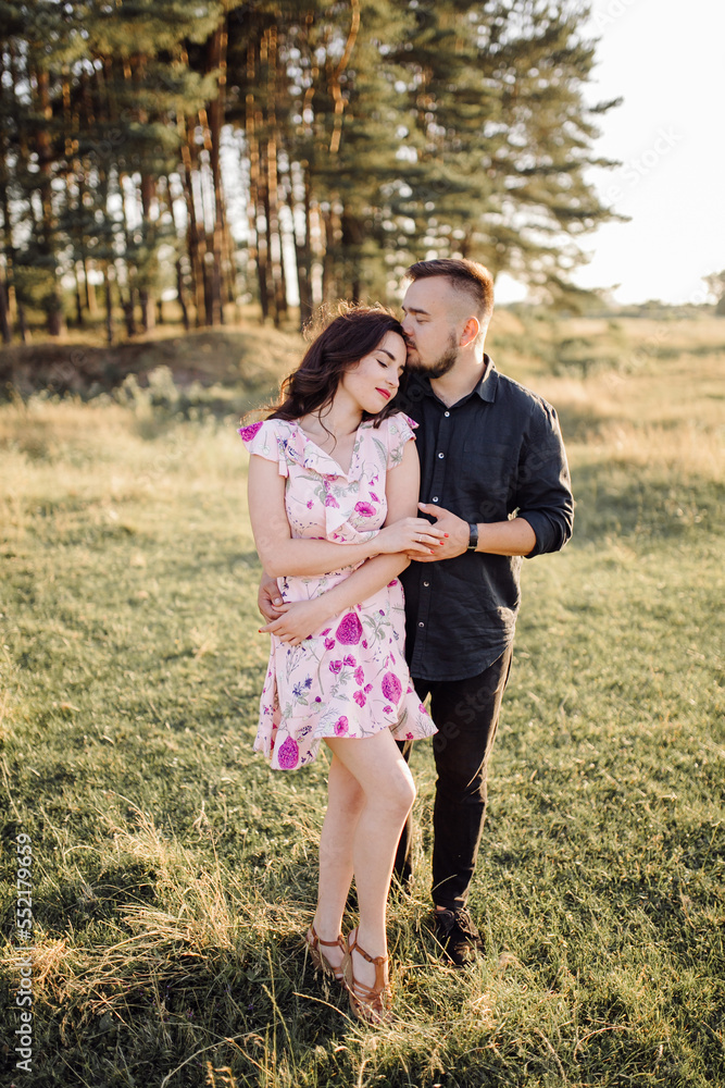 Young couple in love walking in the park Young couple in love walking in the park