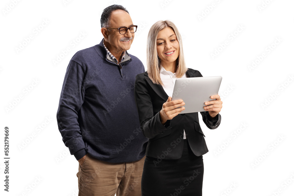 Businesswoman presenting something to a mature man on a digital tablet Businesswoman presenting something to a mature man on a digital tablet