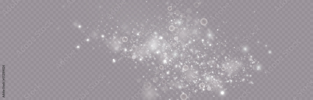 Particles of white magic dust. Shining light particles.Christmas glitter particles. Light effect on a transparent background