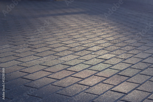 paving stone background with evening light in the city center
