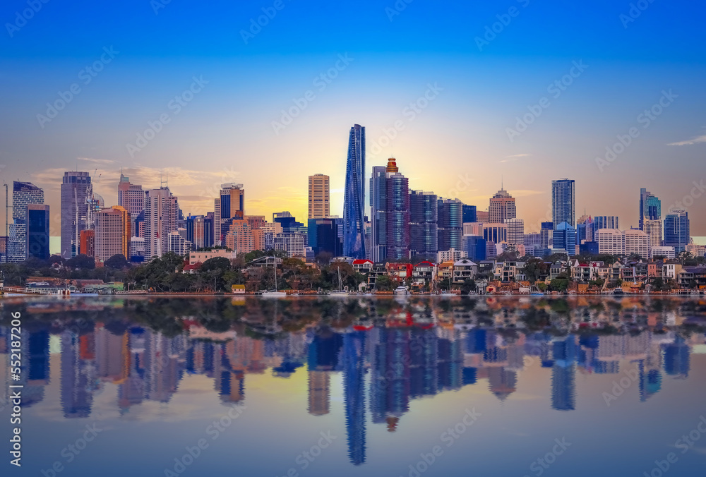 Fototapeta premium Sydney Harbour Australia at Sunset with the reflection of the Buildings and high rise offices of the City in the water