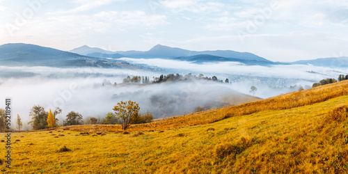 Gorgeous morning landscape of the countryside in the mountains with morning fog.
