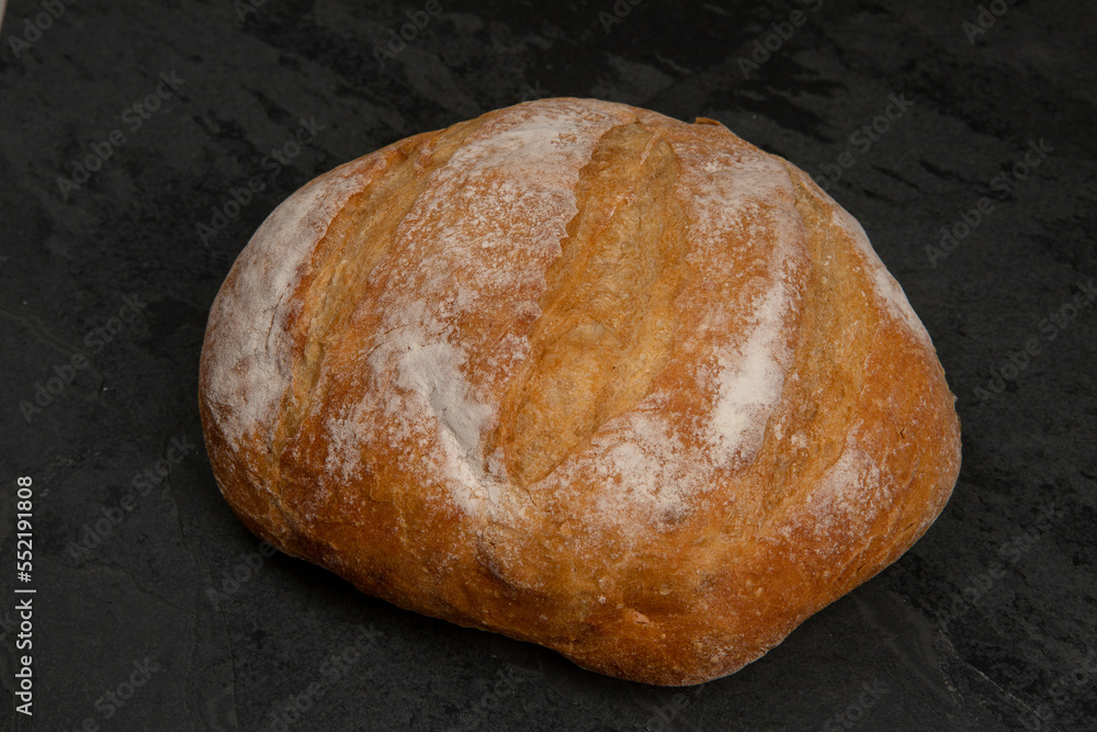 Homemade bread on black stone table Homemade bread on black stone table