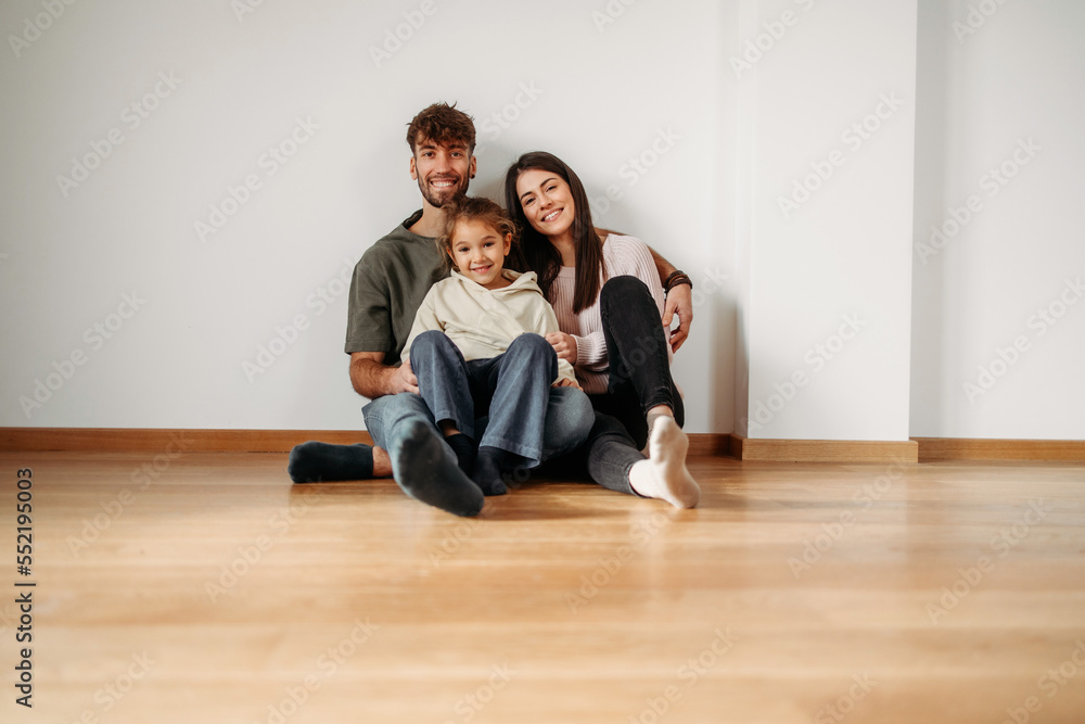 Happy Caucasian family in their new empty home Happy Caucasian family in their new empty home