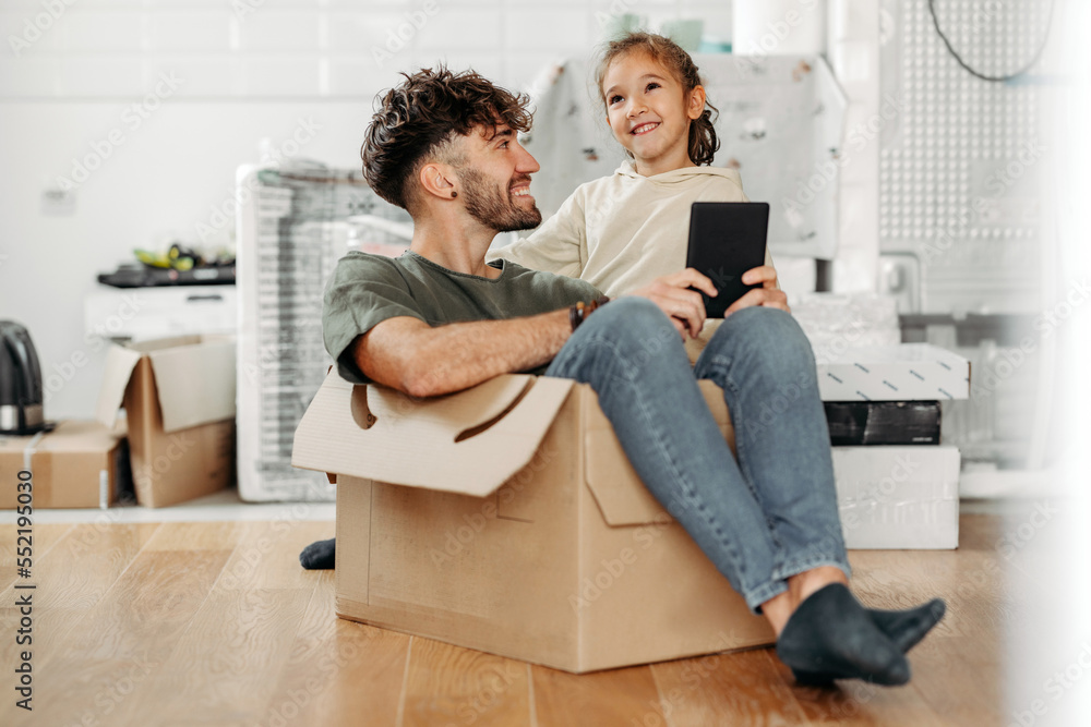 Father and daughter having fun in new apartment Father and daughter having fun in new apartment