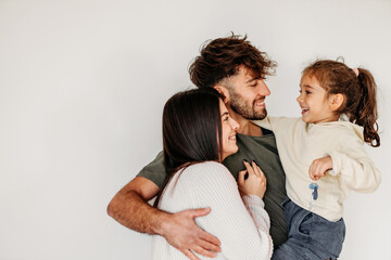Portrait of Happy Caucasian family in their new empty home