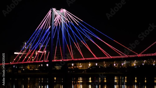 Tricolor bridge in the city at night