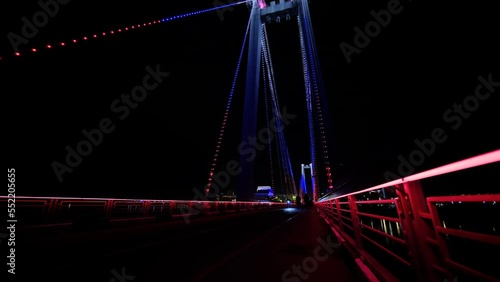 Tricolor bridge in the city at night
