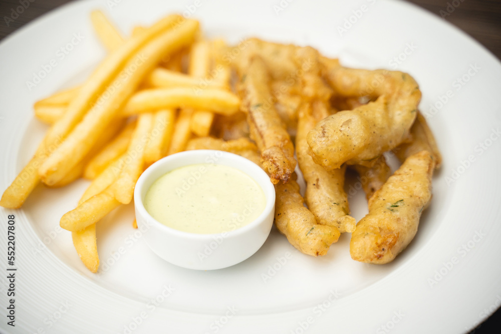 menu with fried shrimp and french fries with sauce on a plate. menu with fried shrimp and french fries with sauce on a plate.