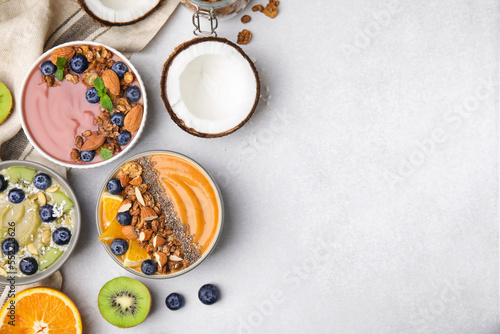 Wallpaper Mural Bowls with different delicious smoothies and fresh ingredients on white table, flat lay. Space for text Torontodigital.ca