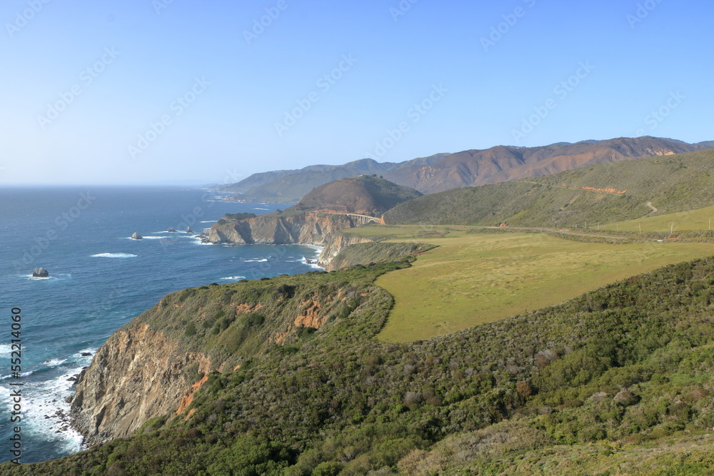 The rugged Big Sur coastline on the Central Coast of California with the famous Bixby Bridge in the distance
