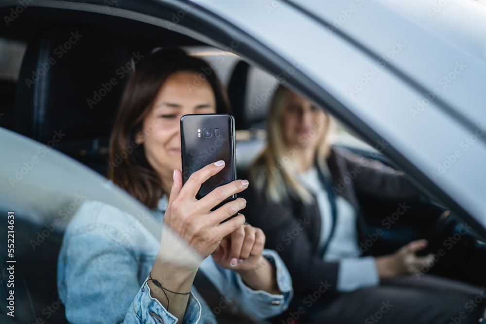 two women drive in a car travel mature caucasian female friends two women drive in a car travel mature caucasian female friends