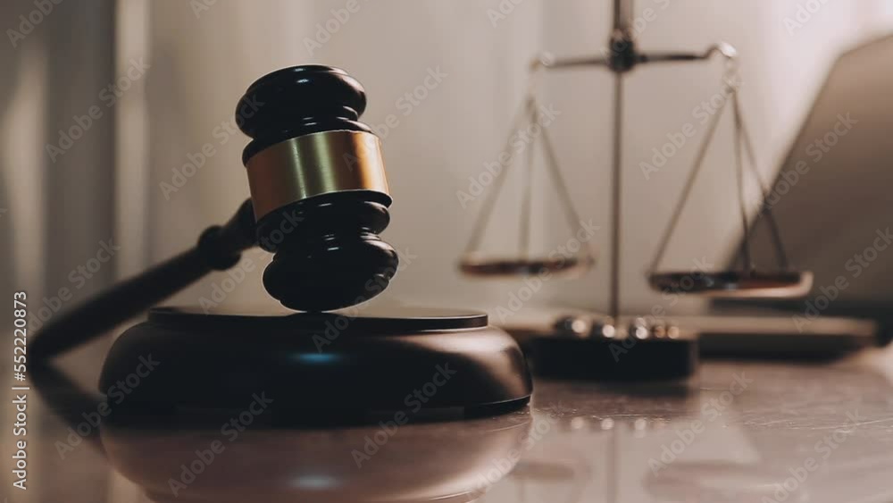 justice and law concept.Male judge in a courtroom on wooden table and Counselor or Male lawyer working in office. Legal law, advice and justice concept. justice and law concept.Male judge in a courtroom on wooden table and Counselor or Male lawyer working in office. Legal law, advice and justice concept.