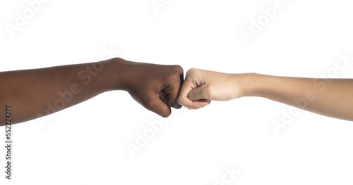 Multiethnic young women give fist bump to each other, they show business friend team, have positive expressions agreement. Handshake business unity concept. white background isolated